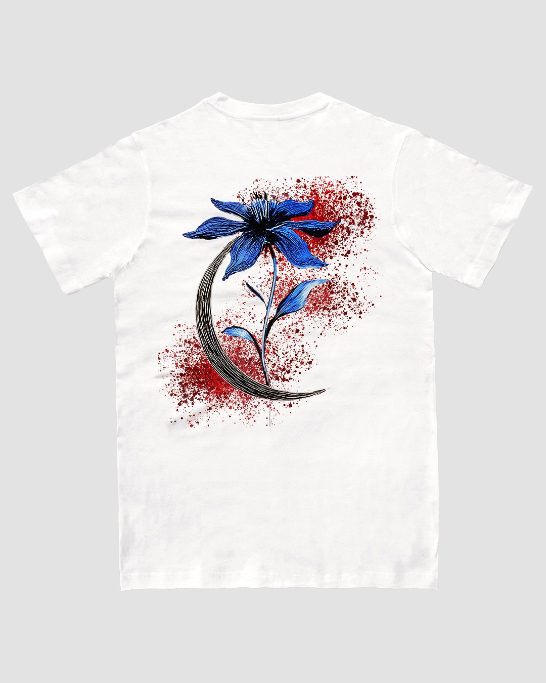 White t-shirt with blue flower and crescent moon on the back